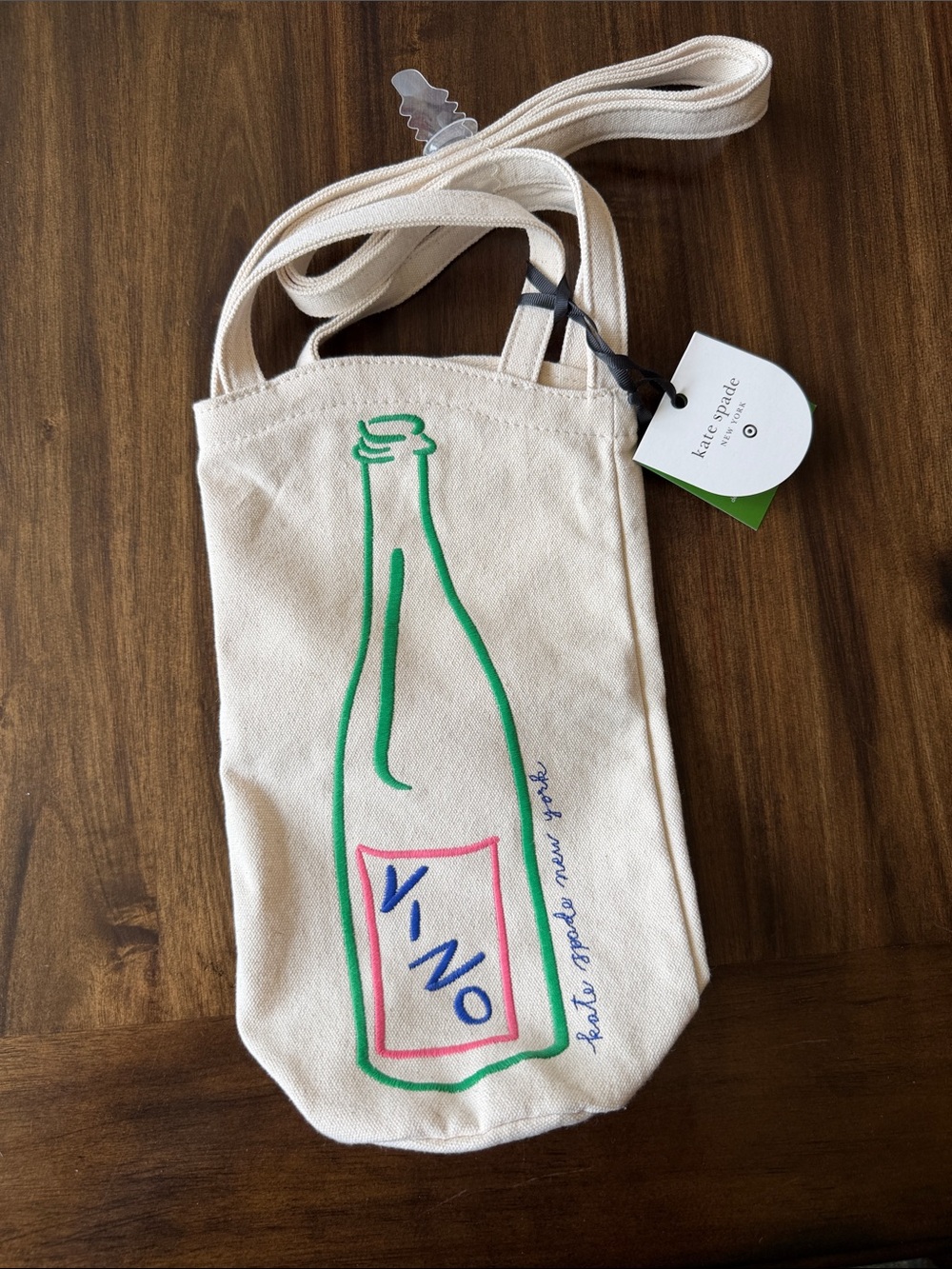kate spade x Target cream canvas wine bottle crossbody with green & pink accents